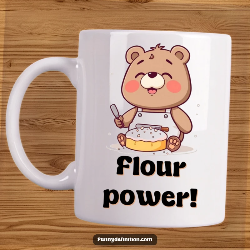 Funny mug featuring a clumsy bear wearing an apron, covered in flour while attempting to bake a cake.