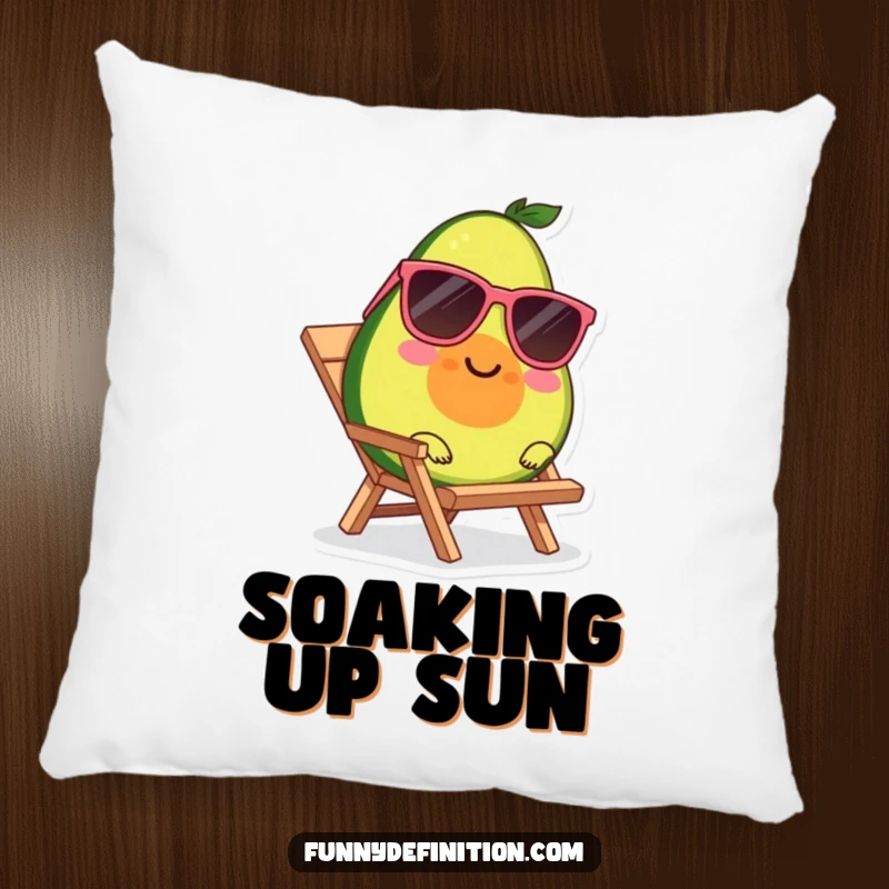 Funny decorative pillow with a smiling avocado wearing sunglasses, relaxing on a tiny beach chair.