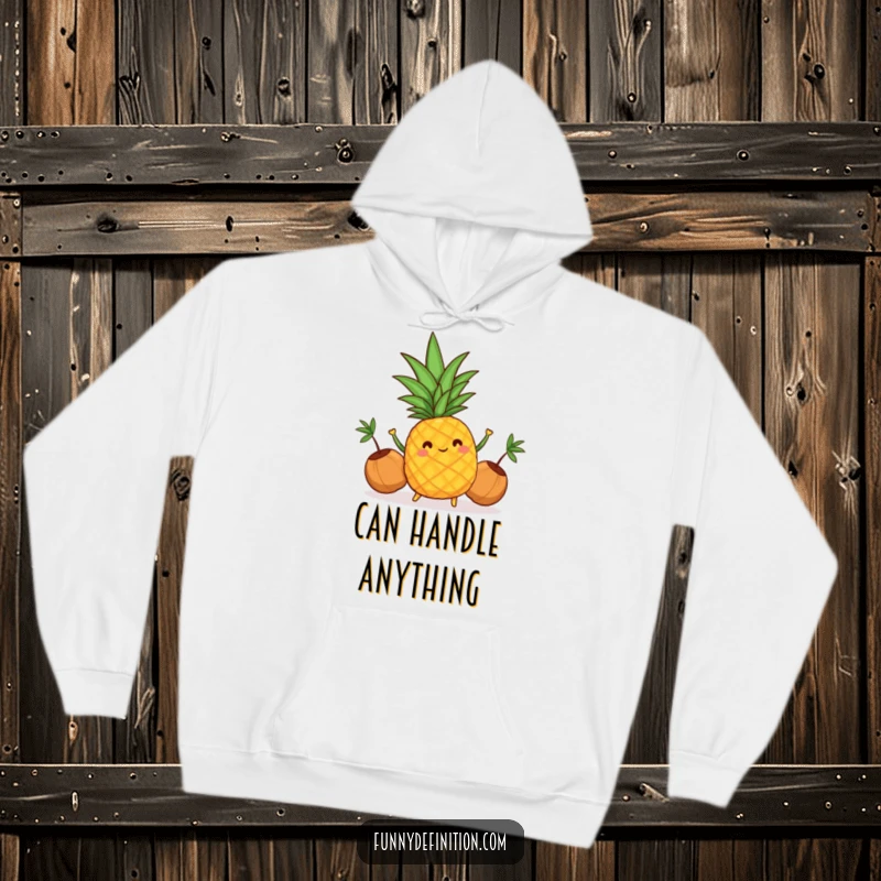 Funny hoodie featuring a cheerful pineapple juggling coconuts, perfect for staying warm and bringing tropical fun.