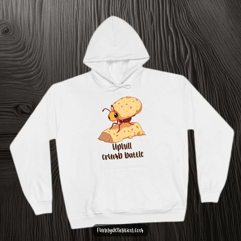 Funny hoodie featuring an ant with a huge crumb, illustrating determination and a comical uphill battle.