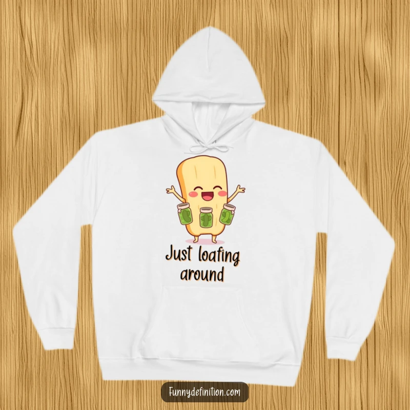Funny hoodie design featuring a gleeful baguette character expertly juggling three tiny pickle jars, perfect for humorous winter warmth.