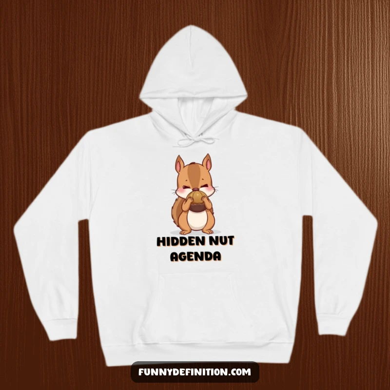 Funny hoodie featuring a nervous squirrel trying to conceal an oversized nut behind its back, offering warmth and hoarding humor.