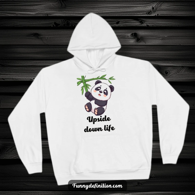 Funny determined panda attempting an upside-down pose on a bamboo branch, featured on a cozy hoodie.