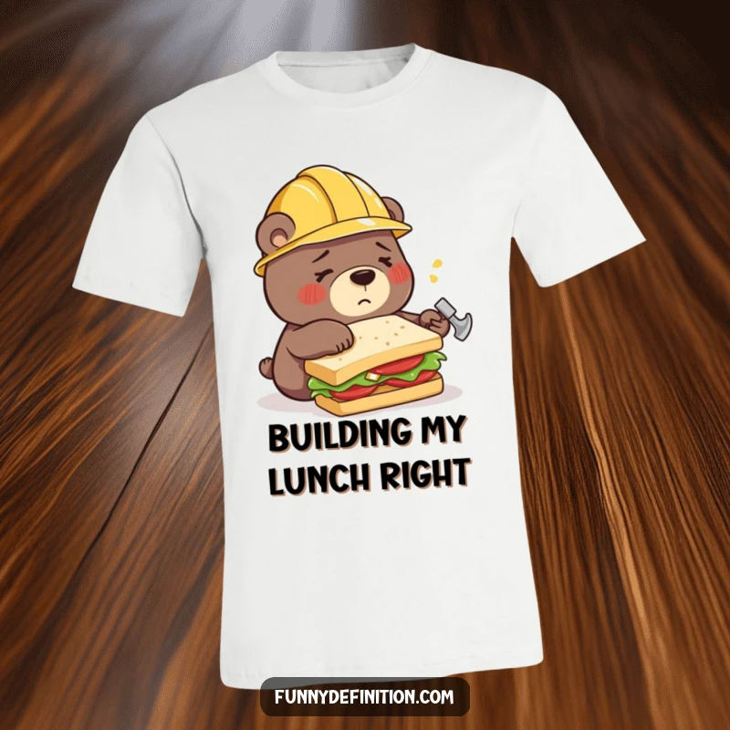 Funny t-shirt featuring a confused bear in a construction helmet, hilariously trying to assemble a sandwich using a hammer instead of tools.